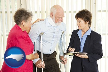 injured person consulting with a personal injury attorney - with North Carolina icon