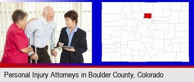 injured person consulting with a personal injury attorney; Boulder County highlighted in red on a map
