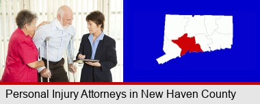 injured person consulting with a personal injury attorney; New Haven County highlighted in red on a map